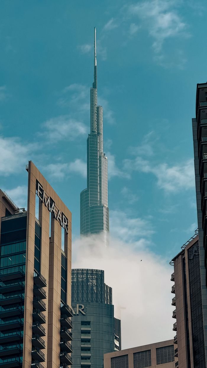 Captivating cityscape showcasing the majestic Burj Khalifa towering above the Dubai skyline on a clear day.